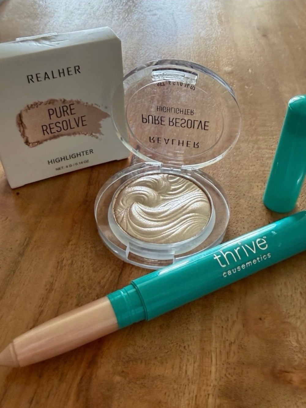 RealHer Pure Resolve Highlighter-champagne. Thrive liner/shadow stick